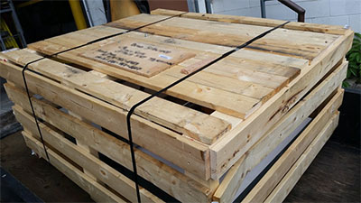 Crate containing Thomas Etching Press arrives in PEI.